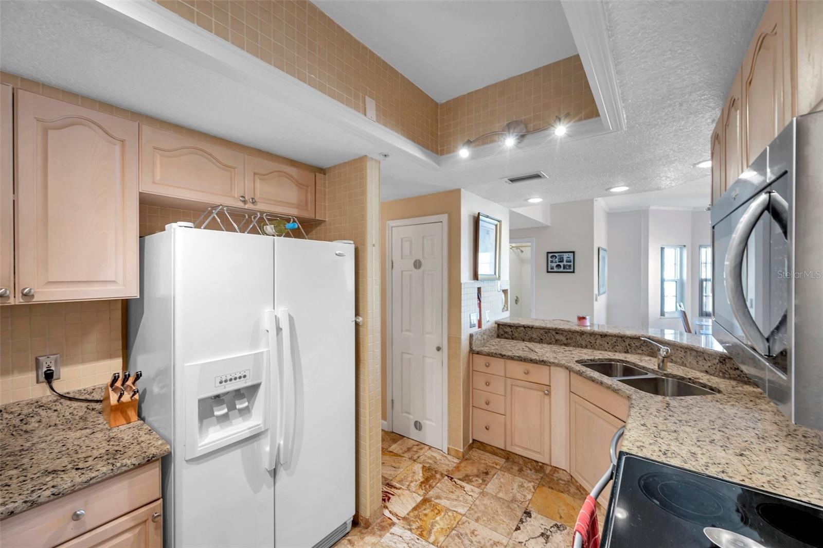 The kitchen has a spacious pantry