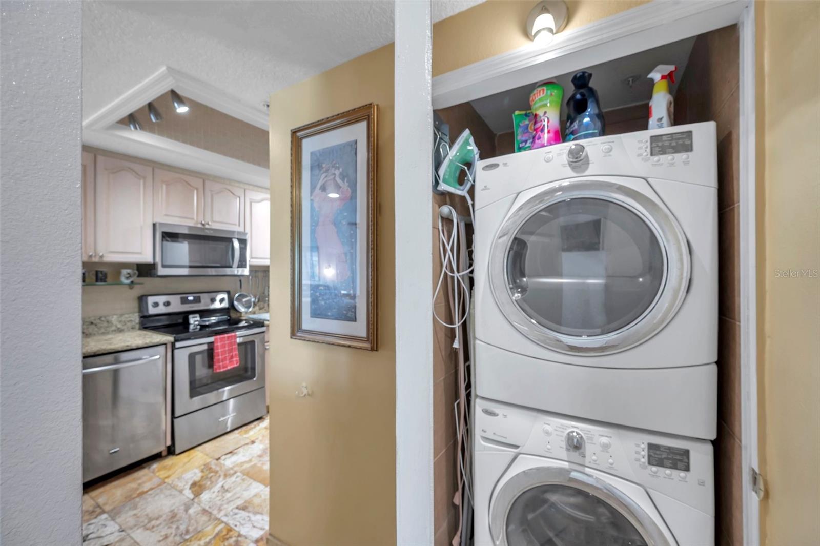 The laundry closet is adjacent to the kitchen