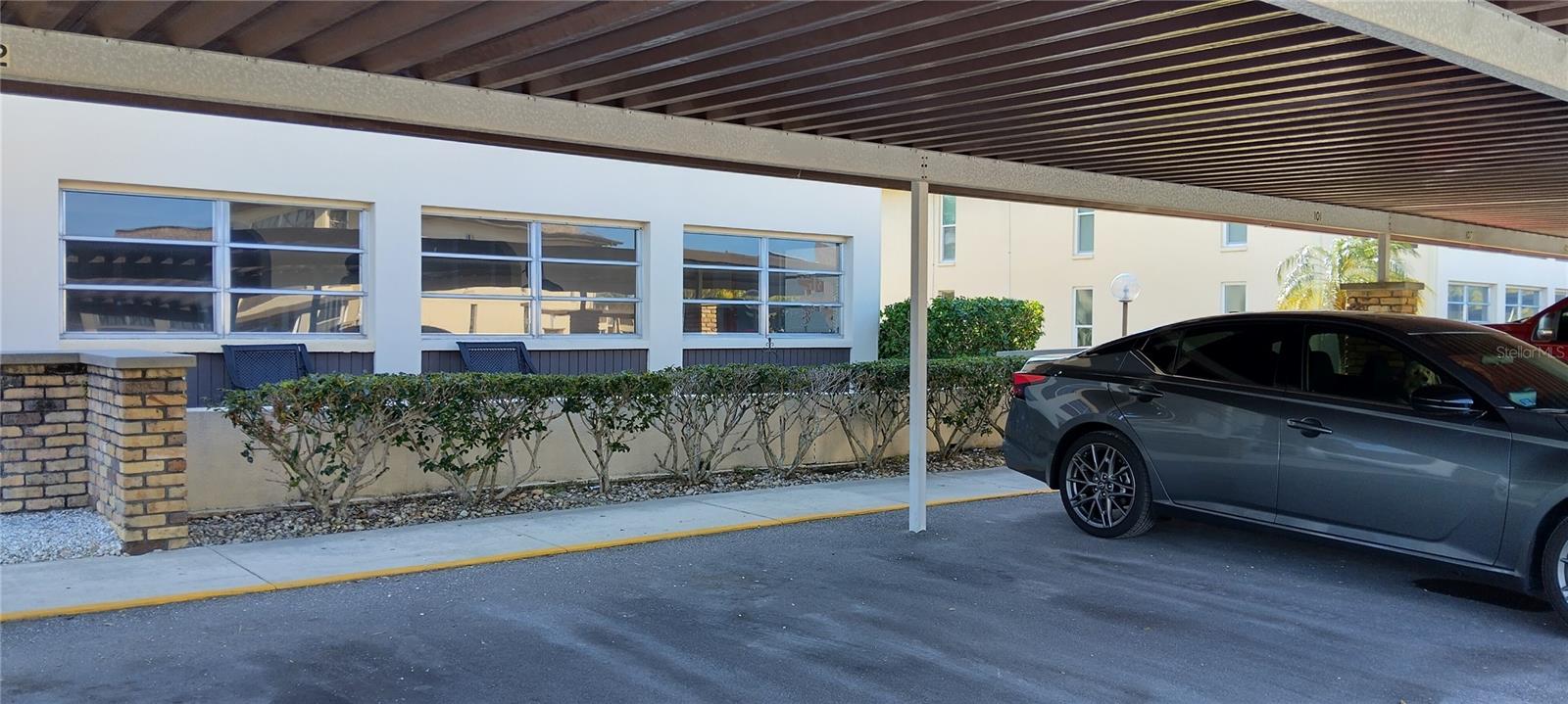 Covered parking directly in front of your unit.