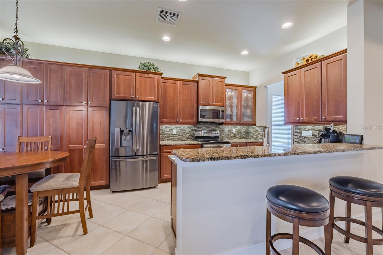 Well appointed Kitchen with an abundance of Cupboards.