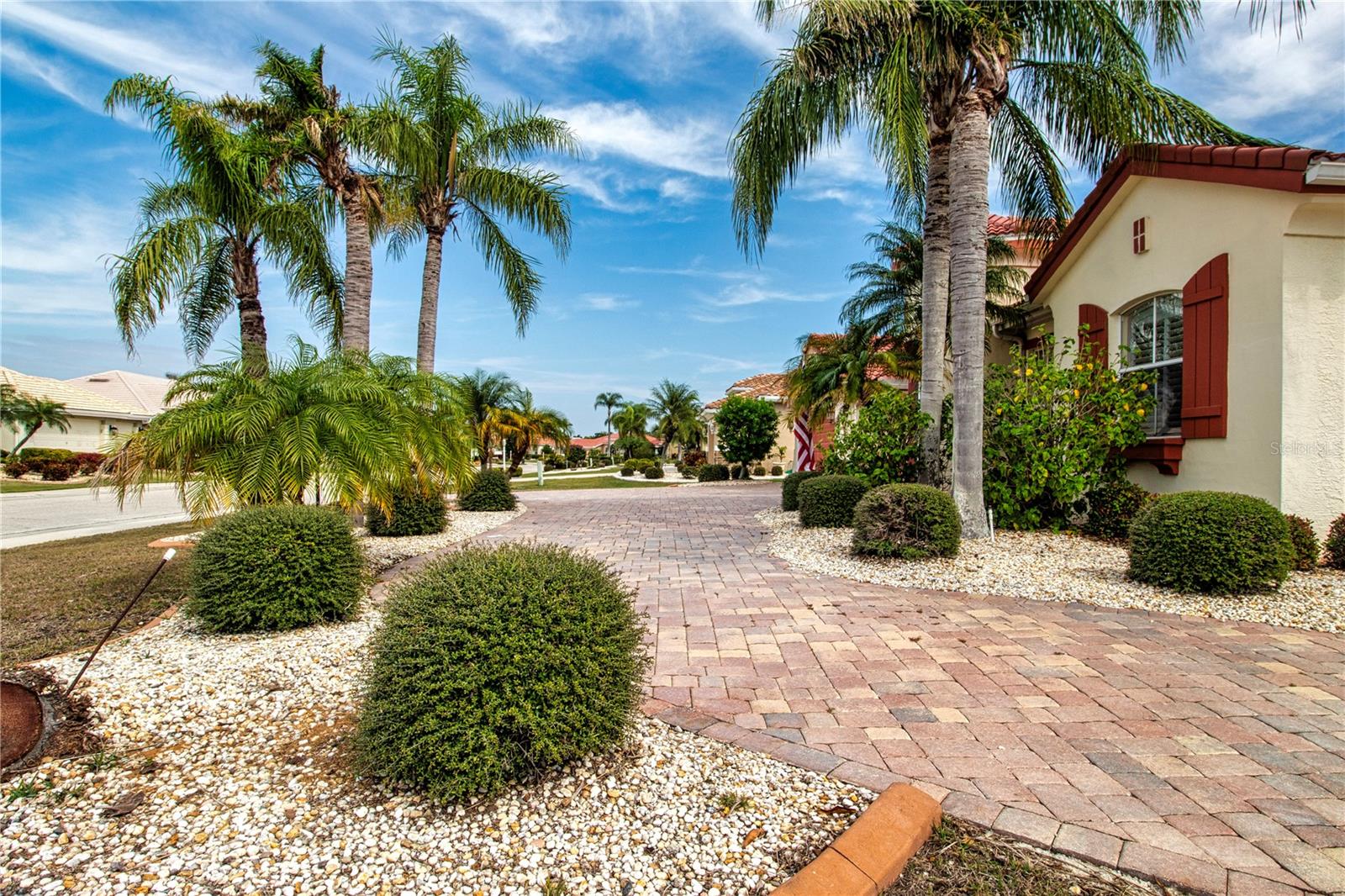 Mature queen Palms and Paver drive