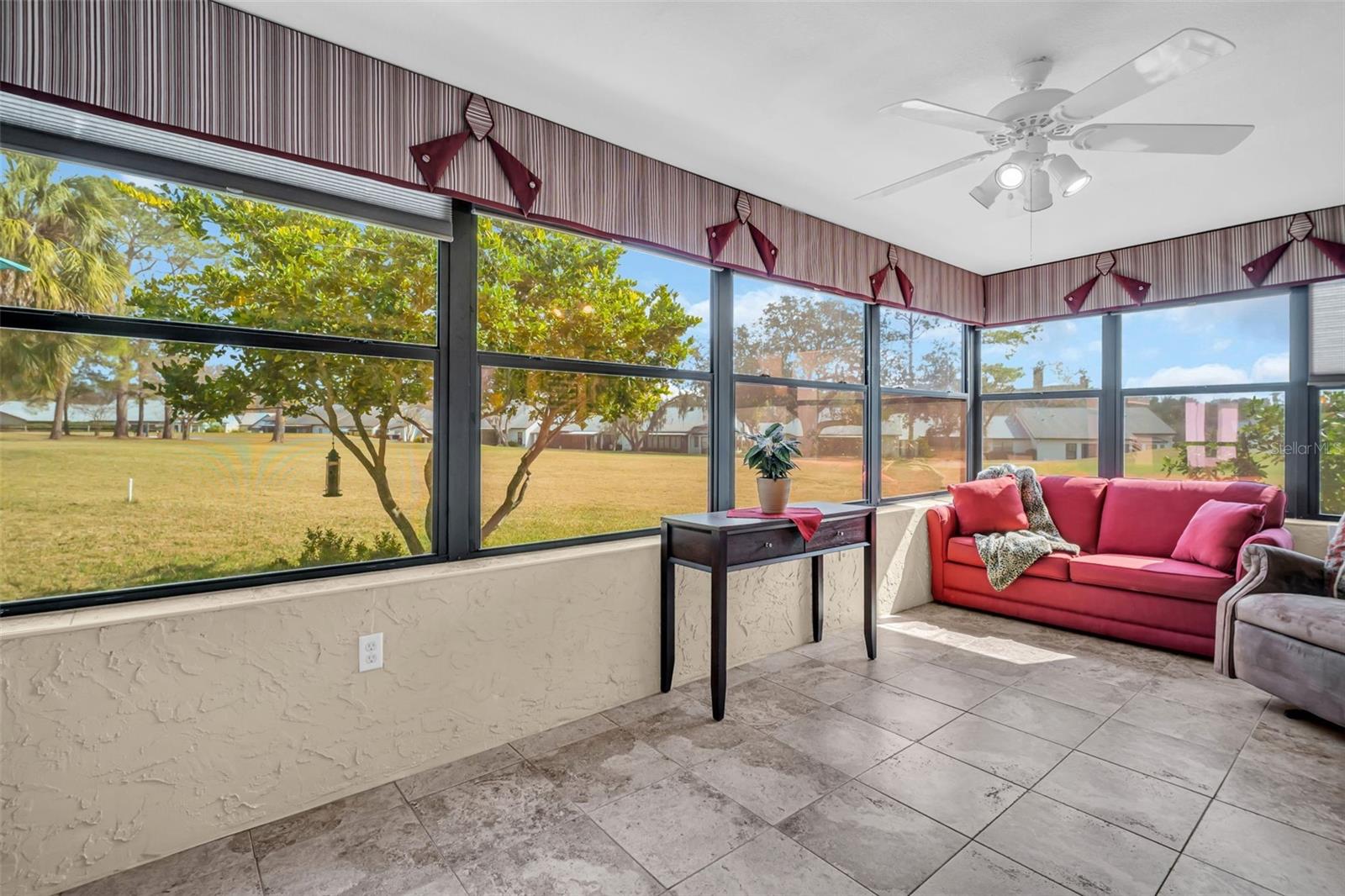 You'll love relaxing in the sunroom to take in the golf views year-round~