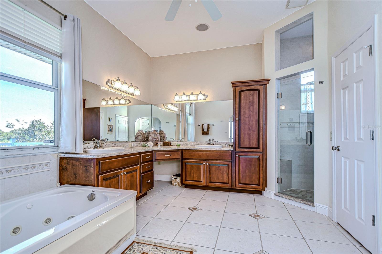 THE BEAUTIFULLY APPOINTED OWNER'S BATHROOM HAS A WALK-IN CLOSET, WATER CLOSET, AND LARGE SHOWER.