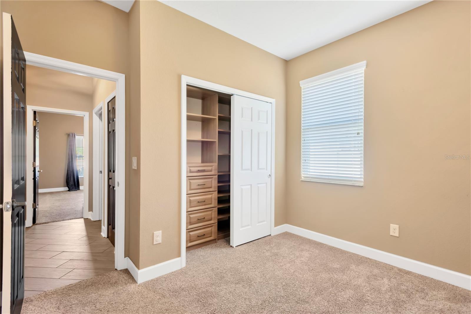 Bedroom #2 built-in closet with custom shelves.