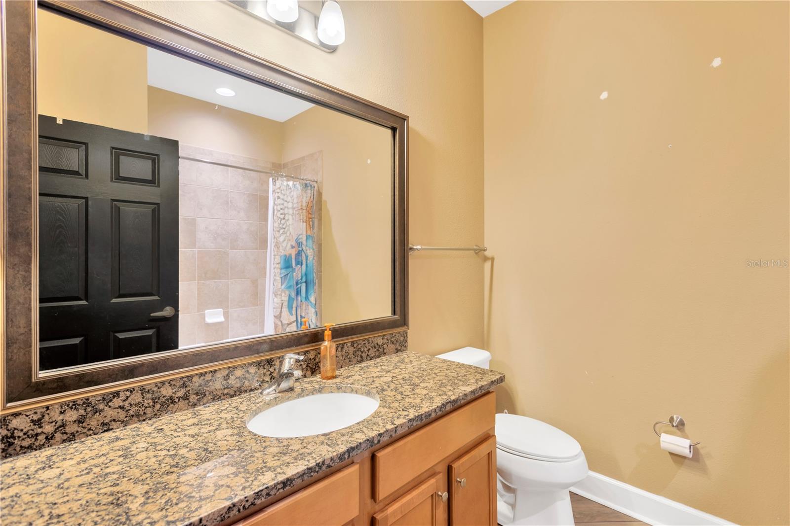 The 2 secondary bedrooms share this full bathroom with a tub/shower combination and spacious vanity.