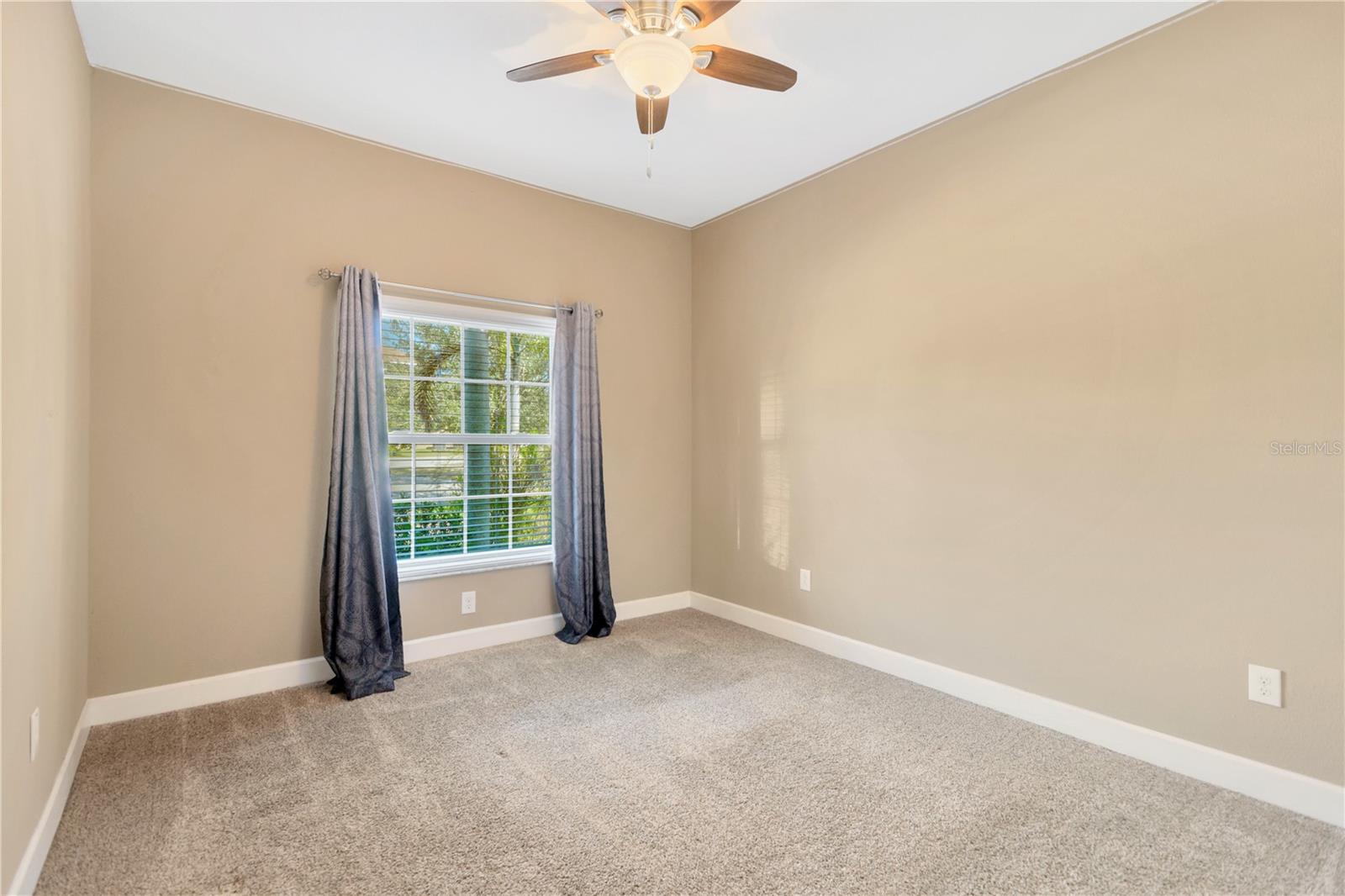 Bedroom #3 is 11.9' x 10.8' and has carpet, a ceiling fan and a built-in closet with a Closet System.