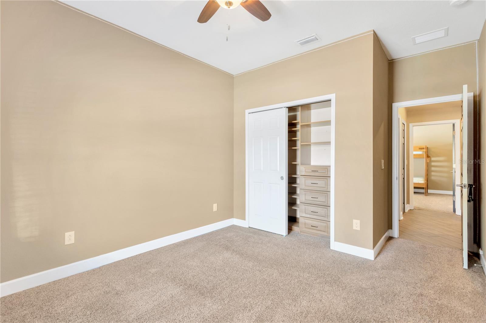 Bedroom #3 built-in closet with custom shelves.