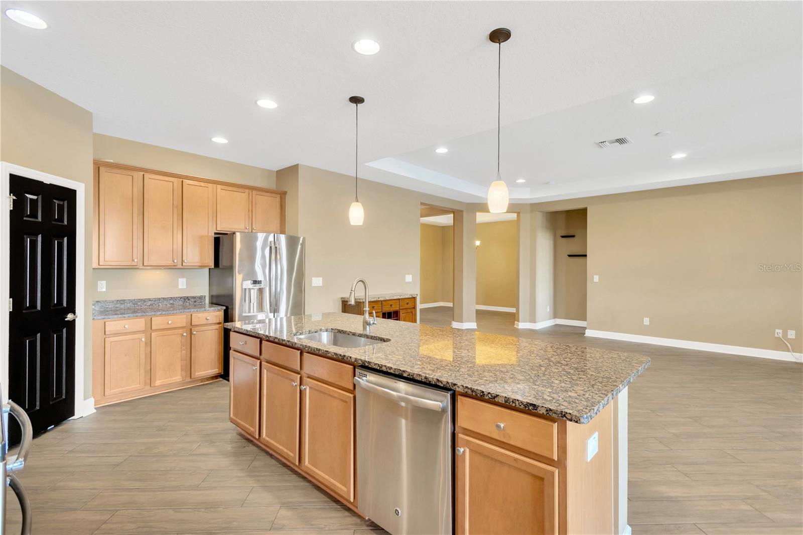 The kitchen flows seamlessly into the expansive great room.