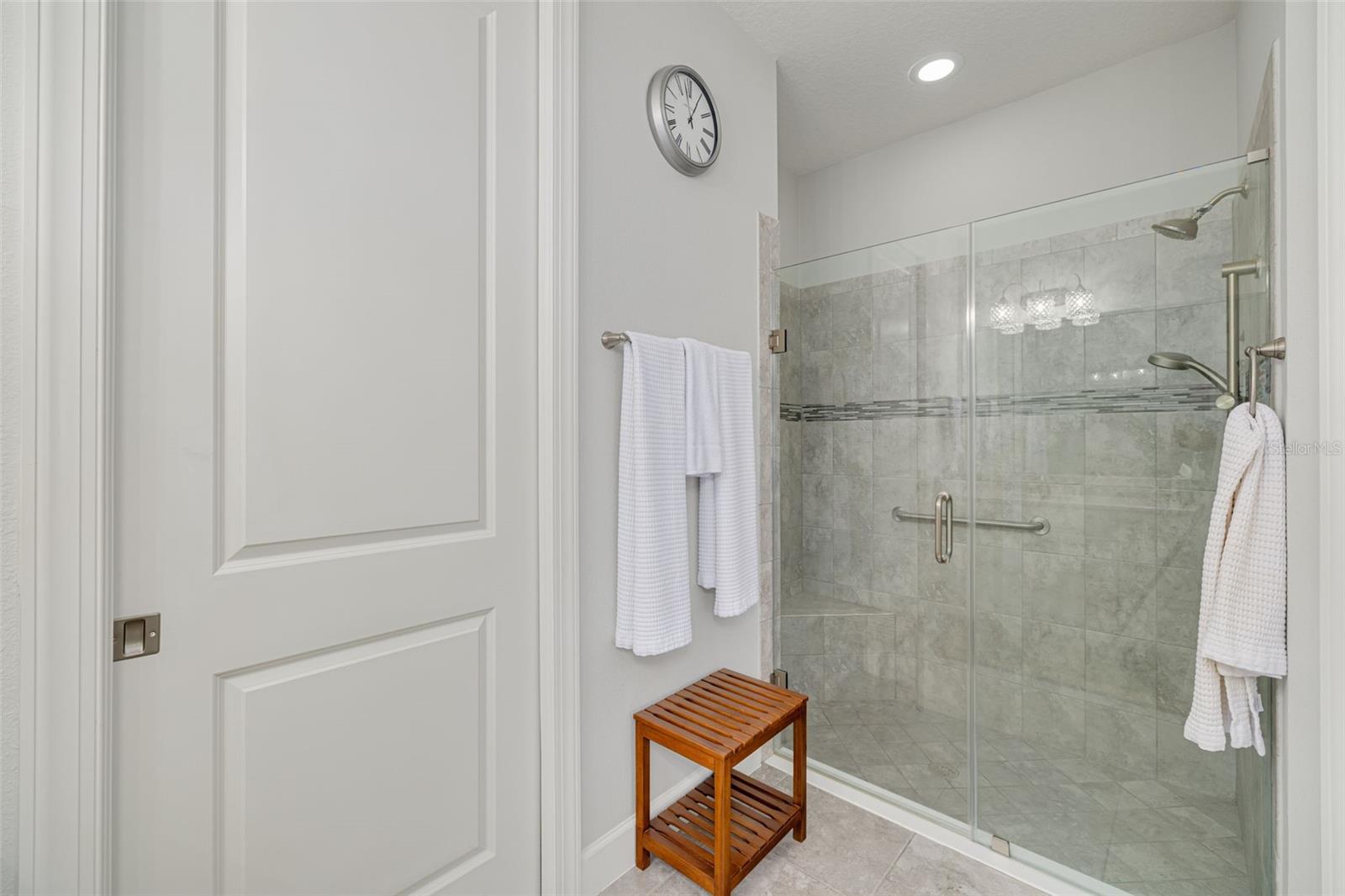 Glass-encased shower with safety bar!