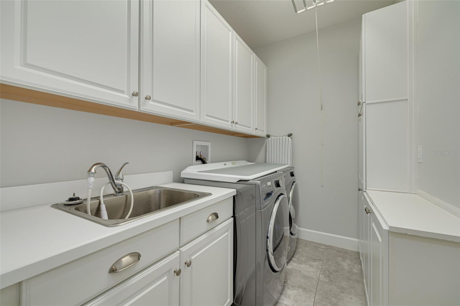 Laundry room with extra cabinets and a new stainless sink!