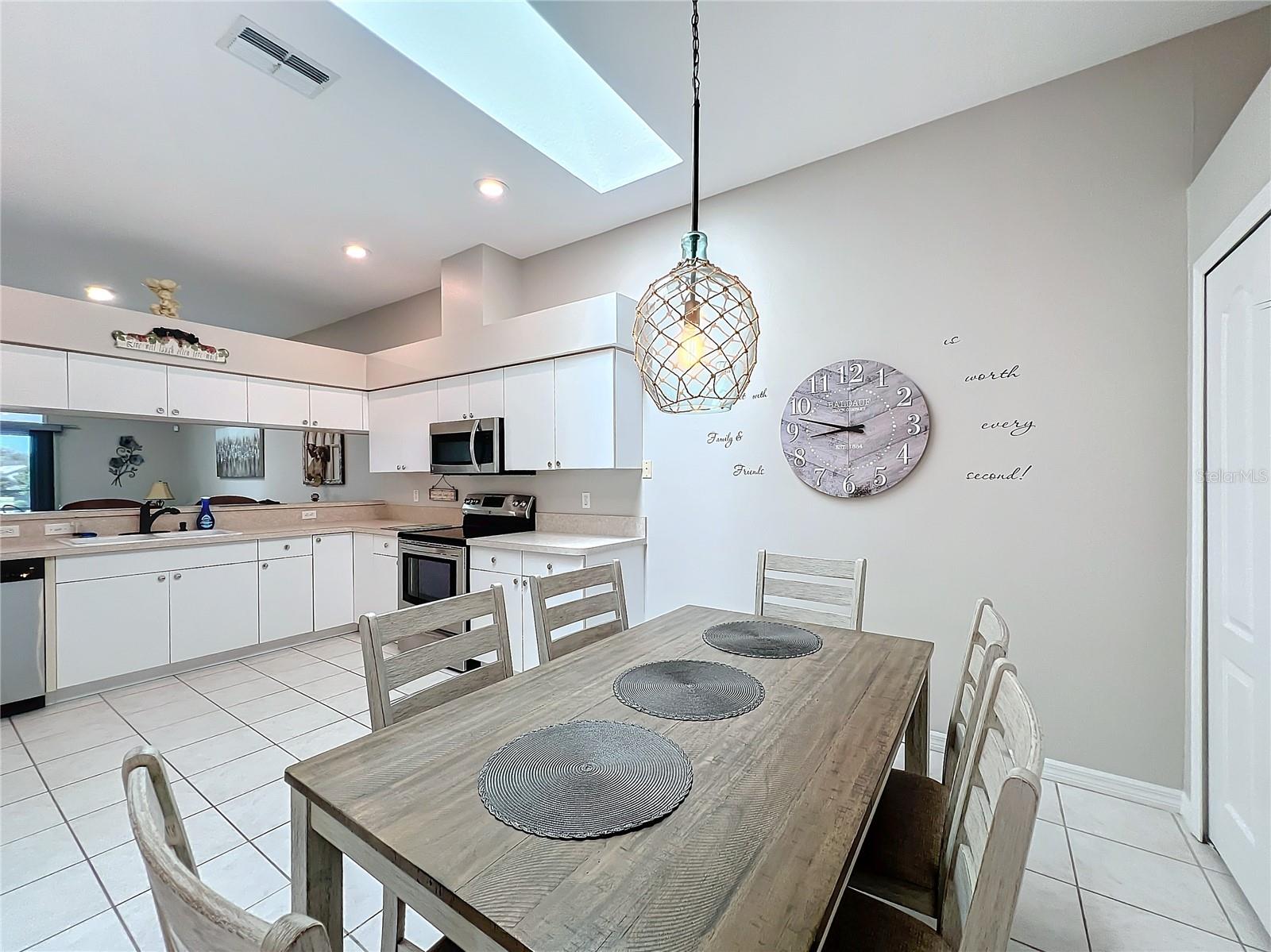 The kitchen is also being utilized for the dining area as well due to the size of the room (12W x 18L). The skylight between both areas is a great source of natural light.