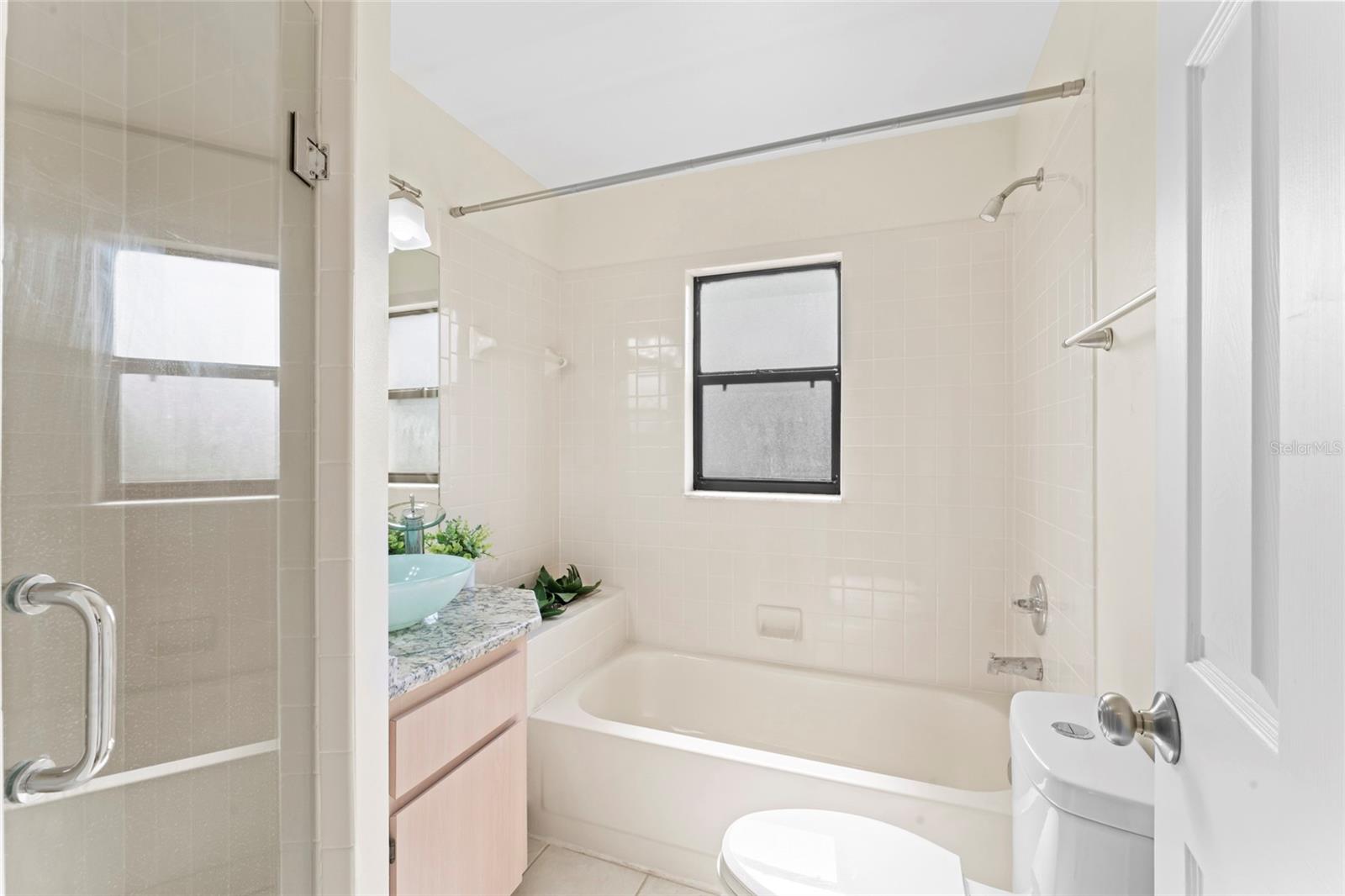 Secondary bathroom features a walk in shower AND tub!