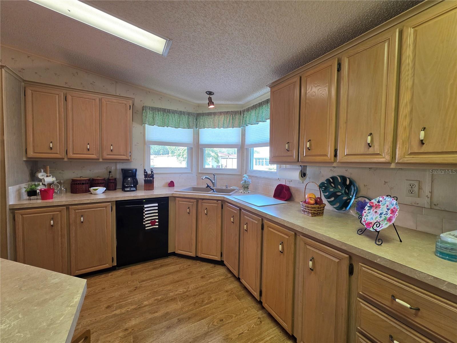 Large front kitchen with lots of cabinetry.