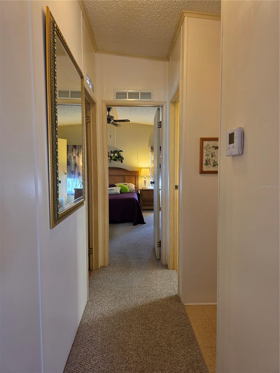 Hallway to bedrooms, bathroom, laundry area & Florida room.