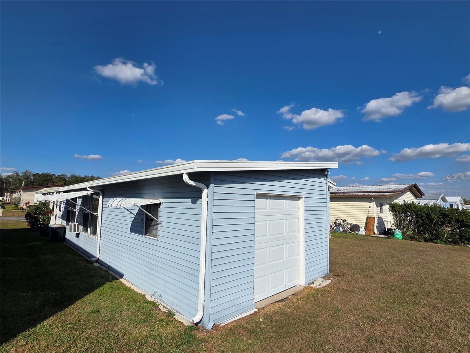 Attached golf cart garage with electric opener.