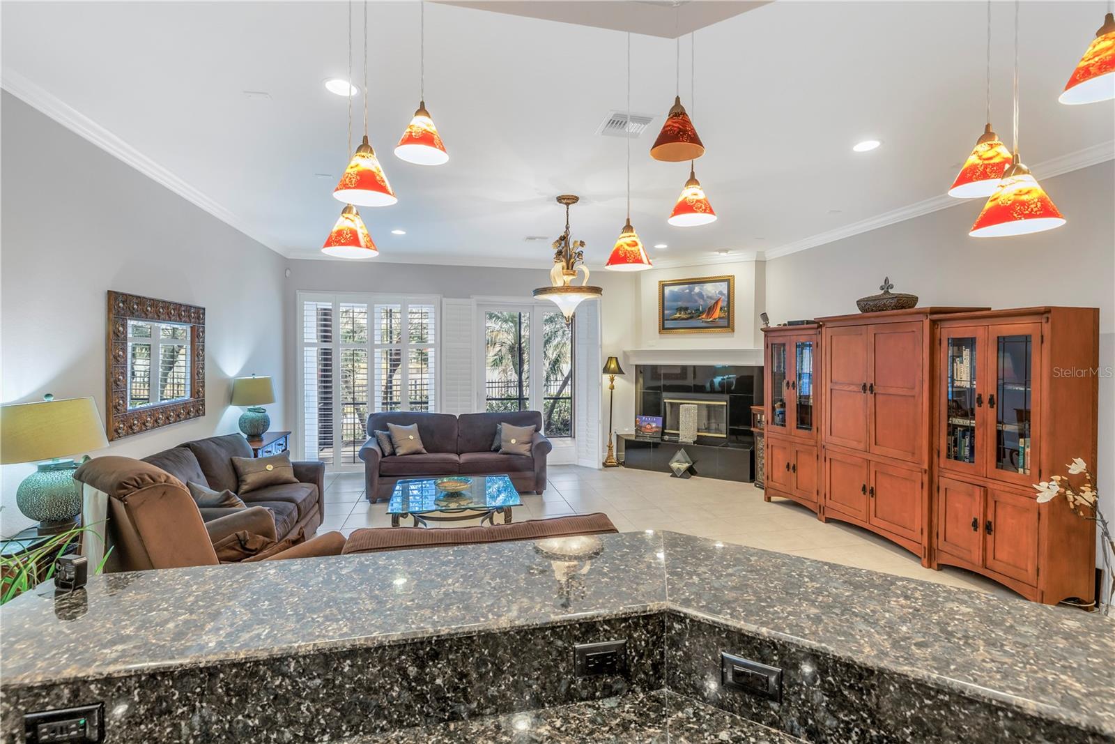 Kitchen breakfast bar connects to the living area