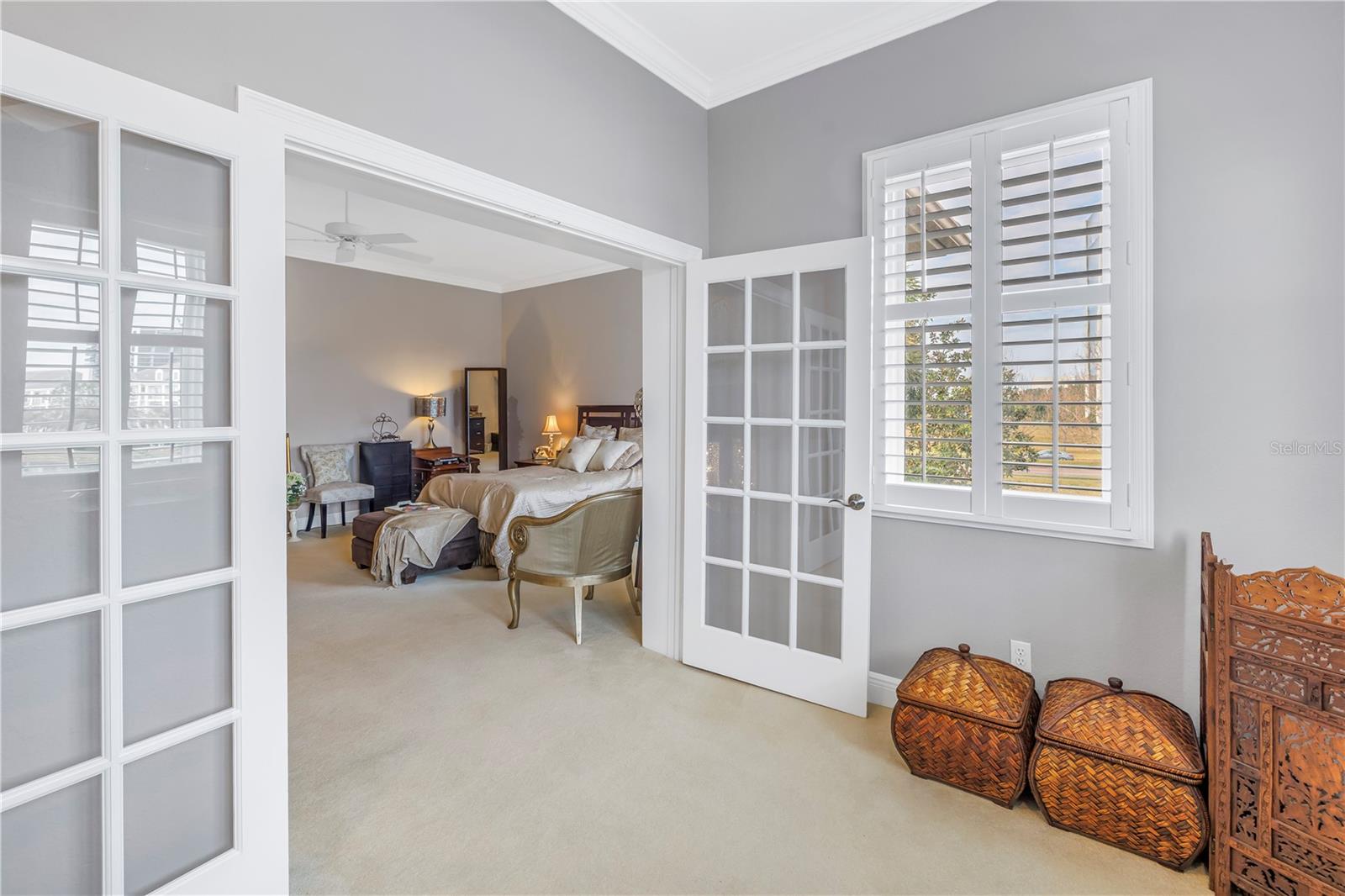 French doors create a quiet retreat in the primary den