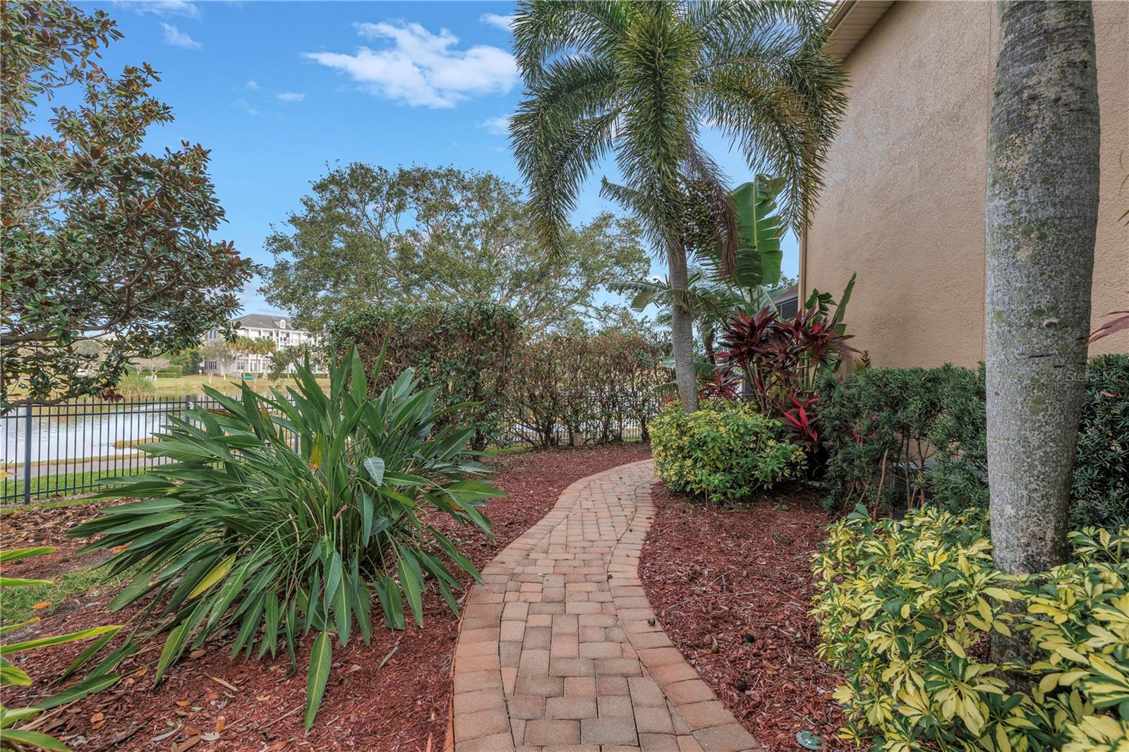 Walkway connects the front entry to the screened enclosure