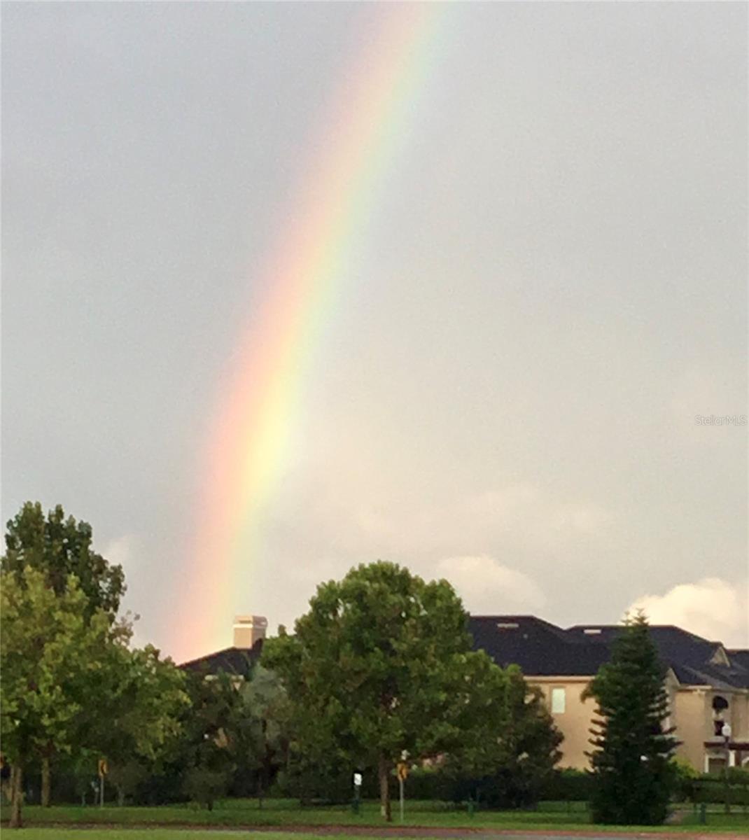 AND the perfect rainbow to enjoy from the upper level of this home