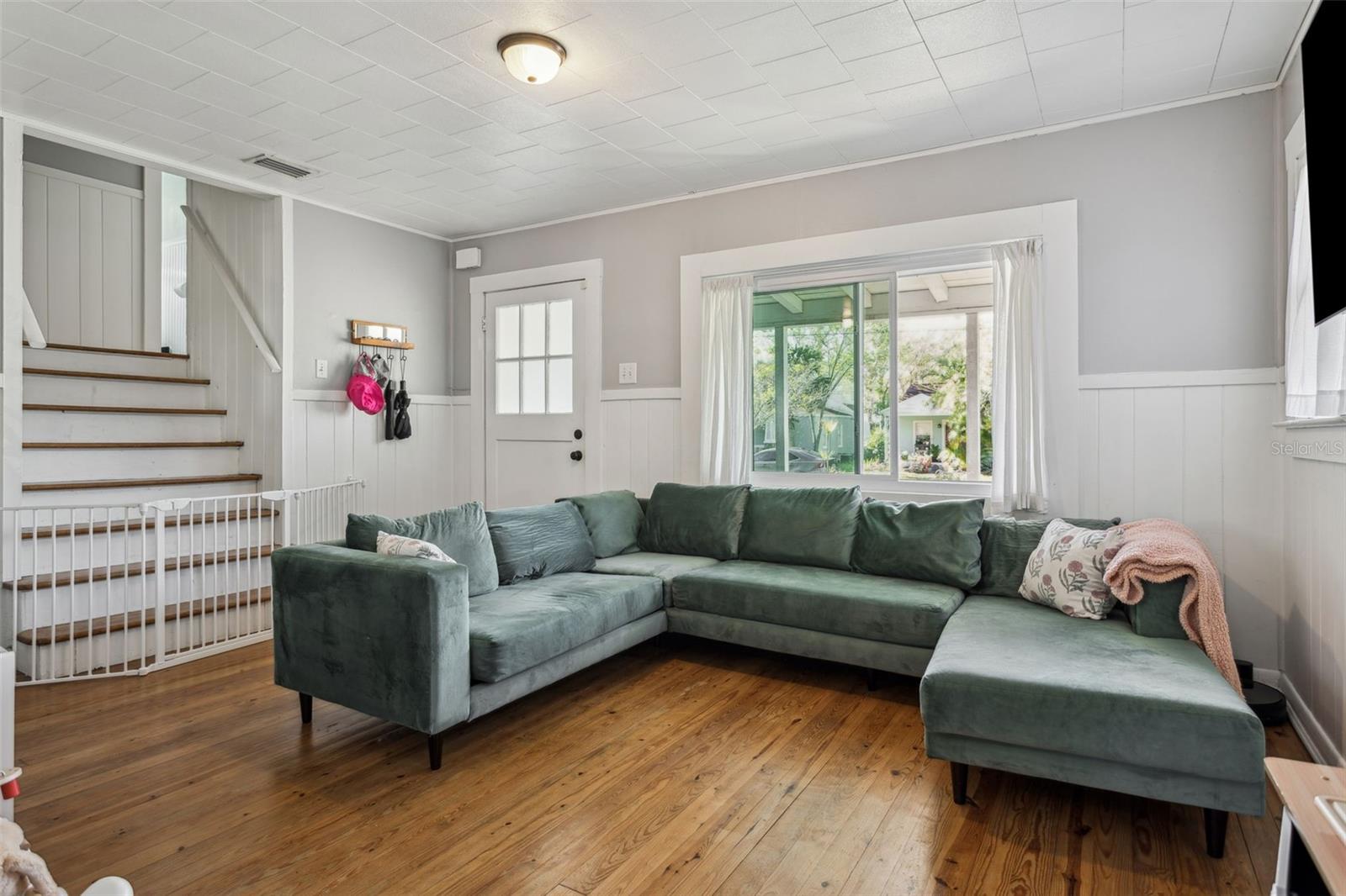 Living room with stairs to bedrooms and loft area