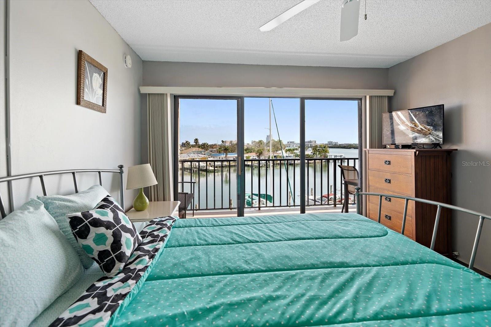 Primary Bedroom with balcony water view