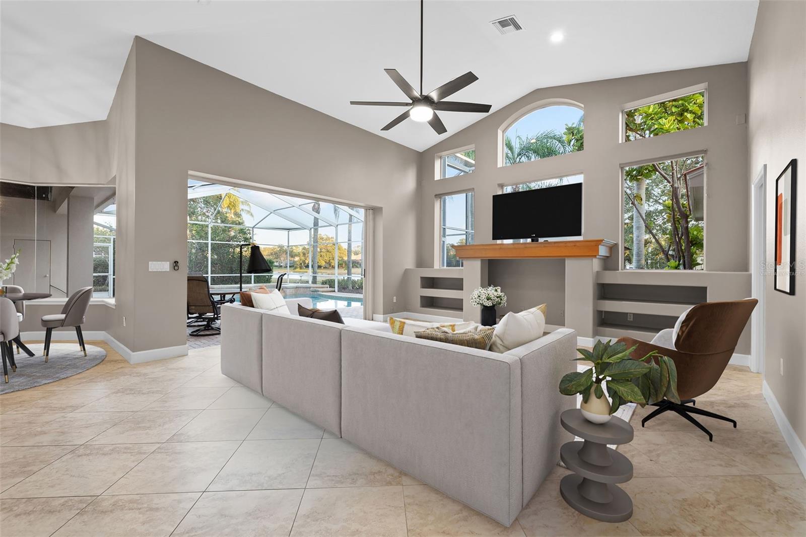 Virtually Staged - Family Room overlooking pool, spa and pond!