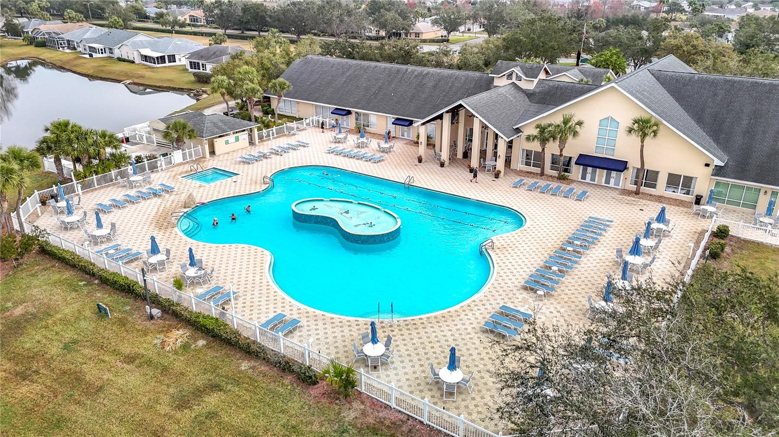 Aerial view of the main exquisite pool outside of the vast clubhouse