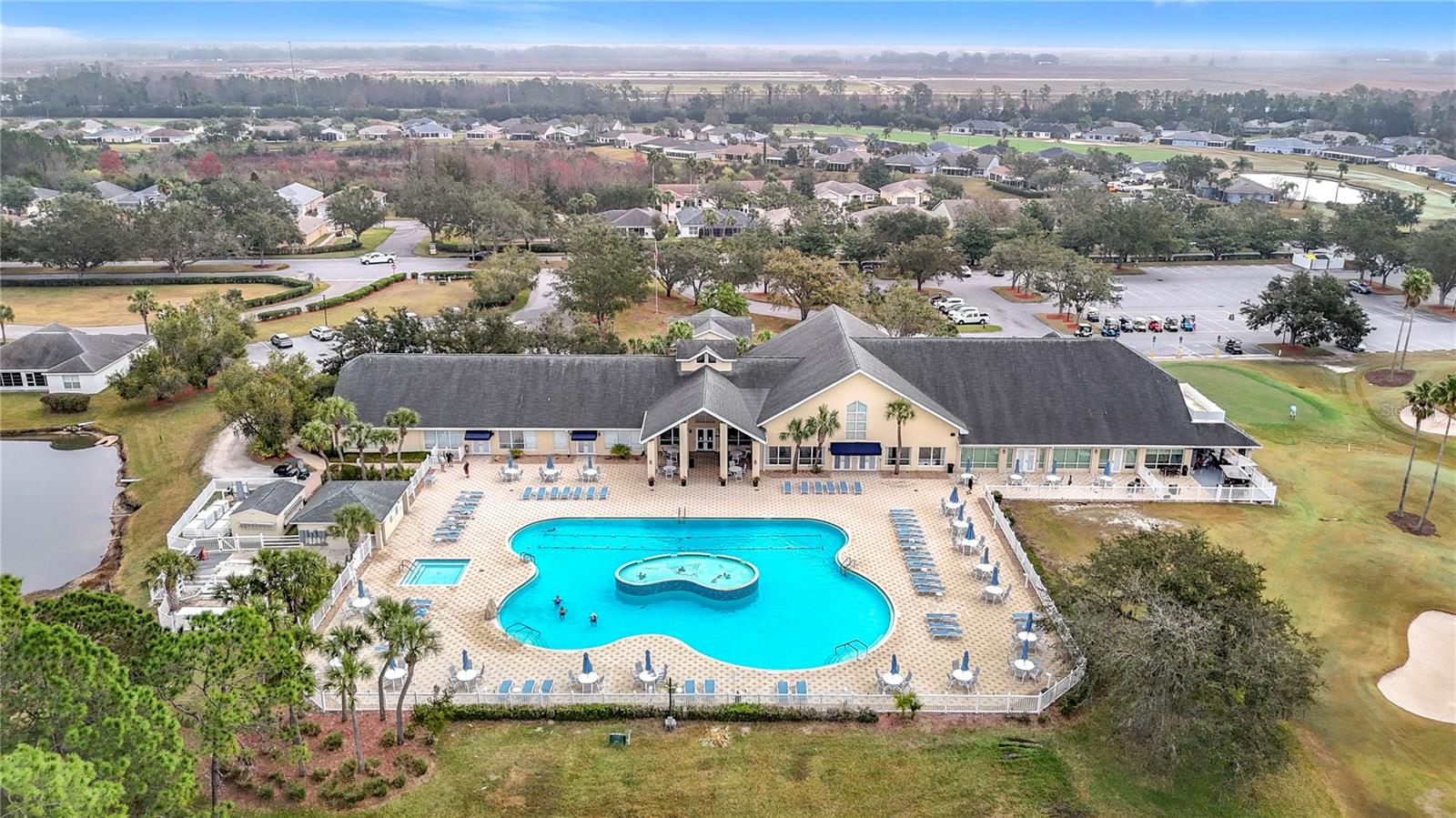 AAerial view of the main exquisite pool outside of the vast clubhouse