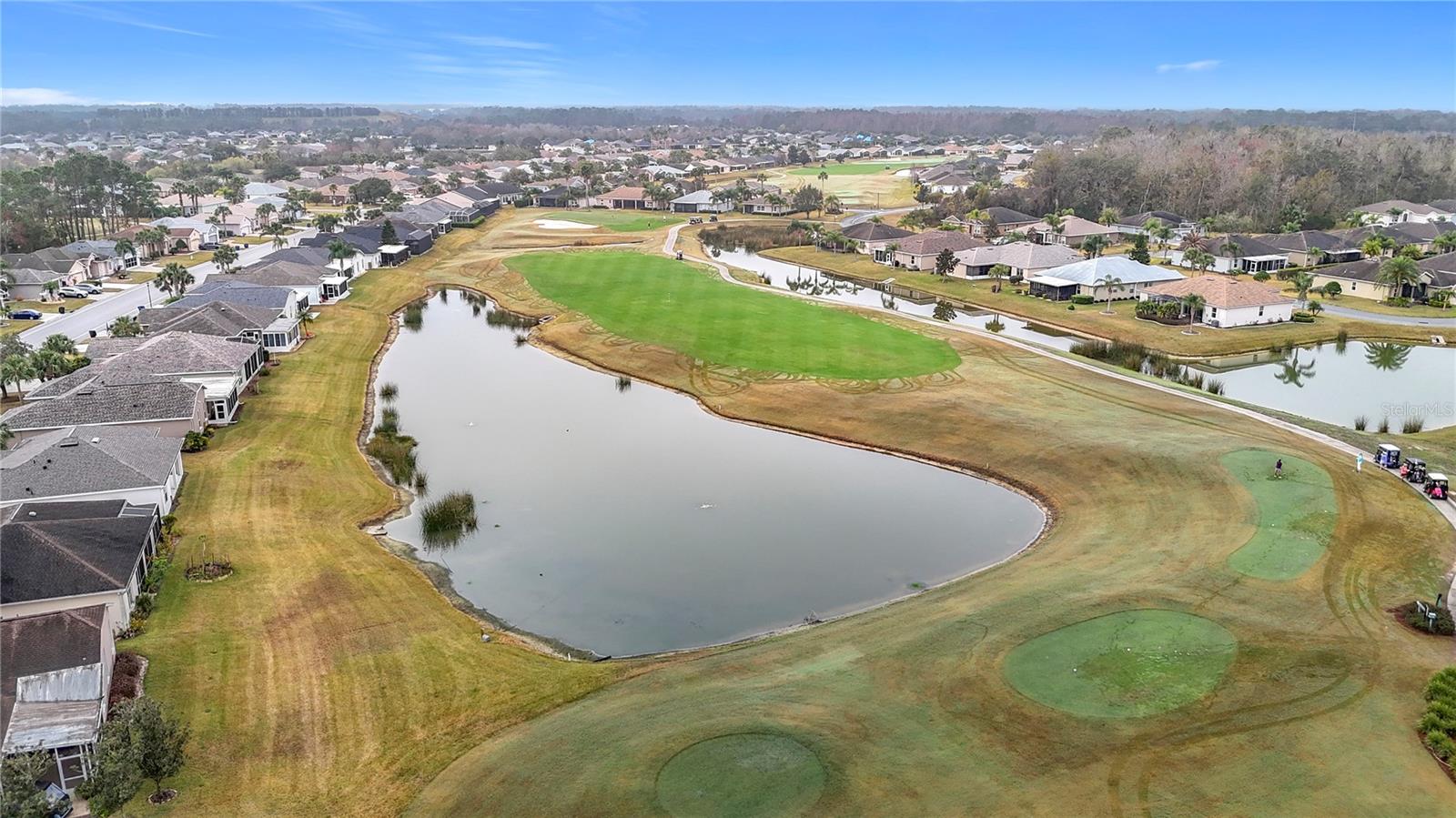 One of two lush private golf courses in this gated community