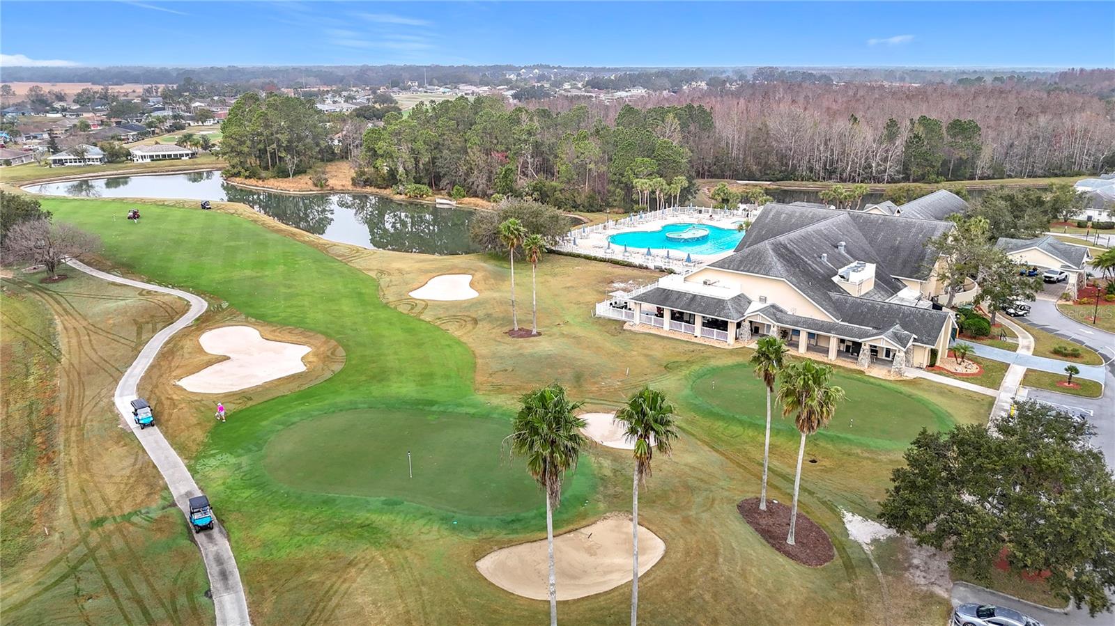 One of two lush private golf courses in this gated community