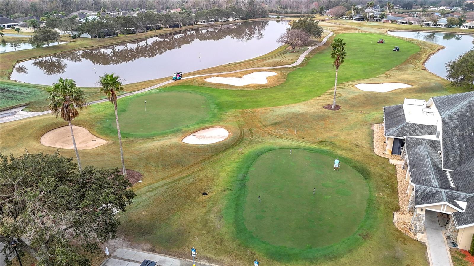 One of two lush private golf courses in this gated community