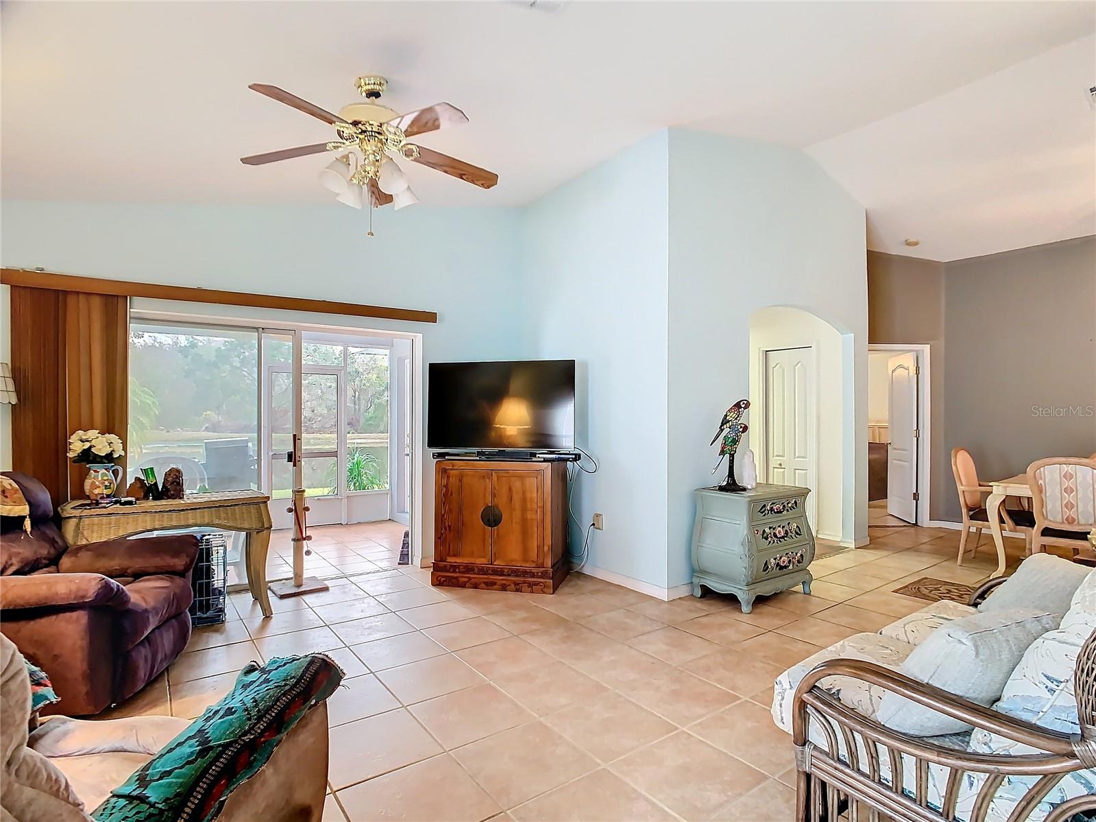 View of the living room with high ceilings from the front door