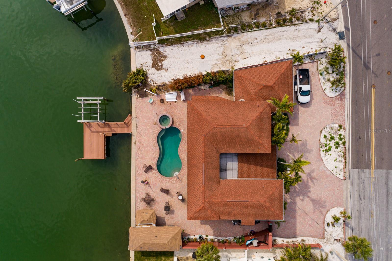 Pebble Tec pool & spa. Composite dock. Boat lift. Paver deck & driveway.