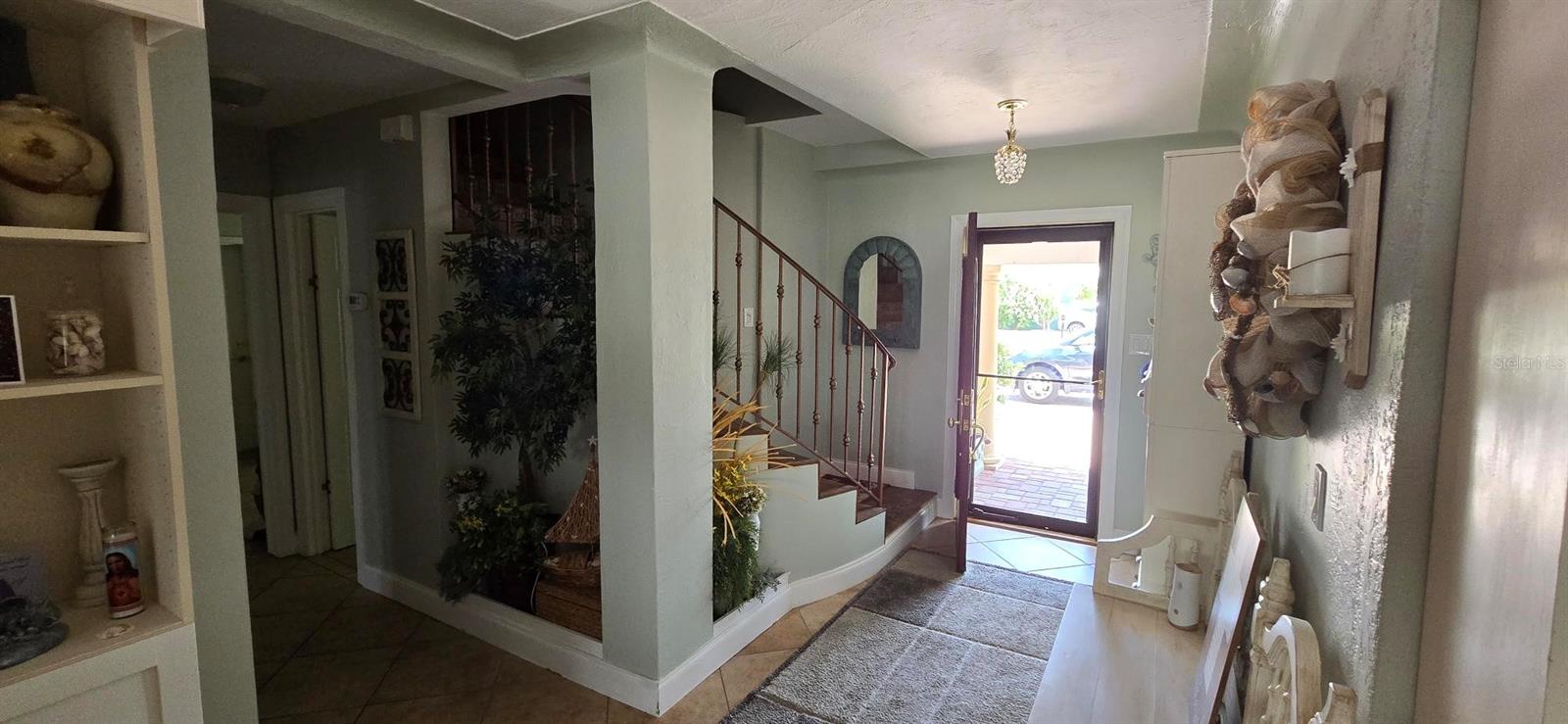 Foyer. (Triplex unit 1, 2-story, 1996 sq ft, 3/3). Pic taken before Hurricane Helene.