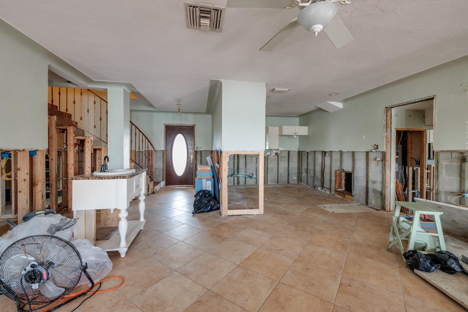 Living/Dining room area. Kitchen on right. (Triplex unit 1, 2-story, 1996 sq ft, 3/3).