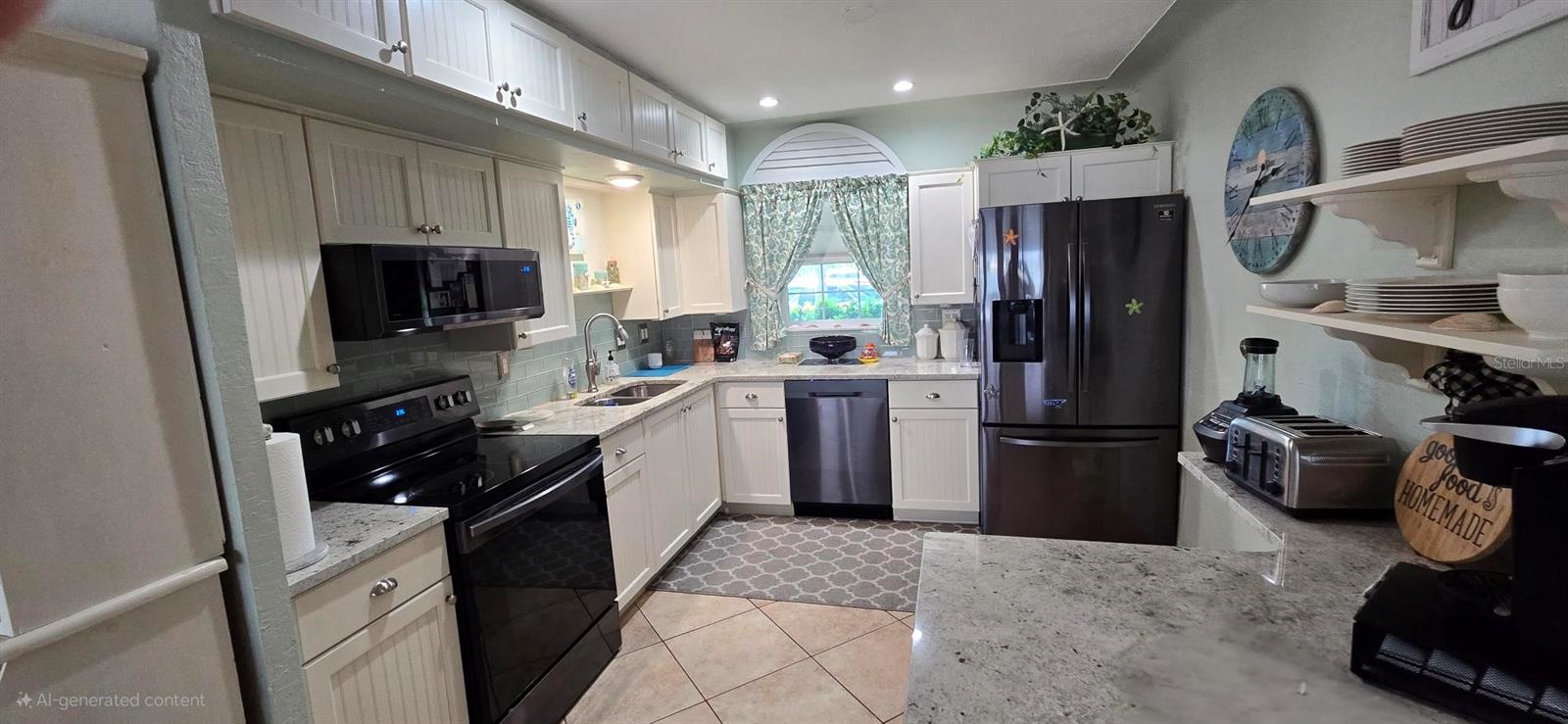 Kitchen. (Triplex unit 1, 2-story, 1996 sq ft, 3/3). Pic taken before Hurricane Helene.