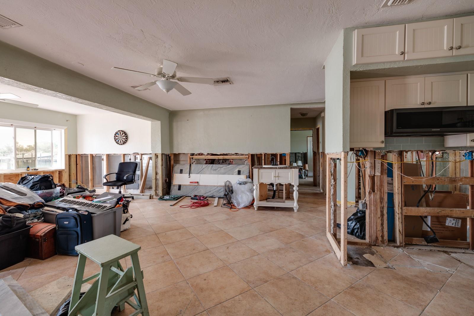 Dining/Living room area & kitchen on right. (Triplex unit 1, 2-story, 1996 sq ft, 3/3).