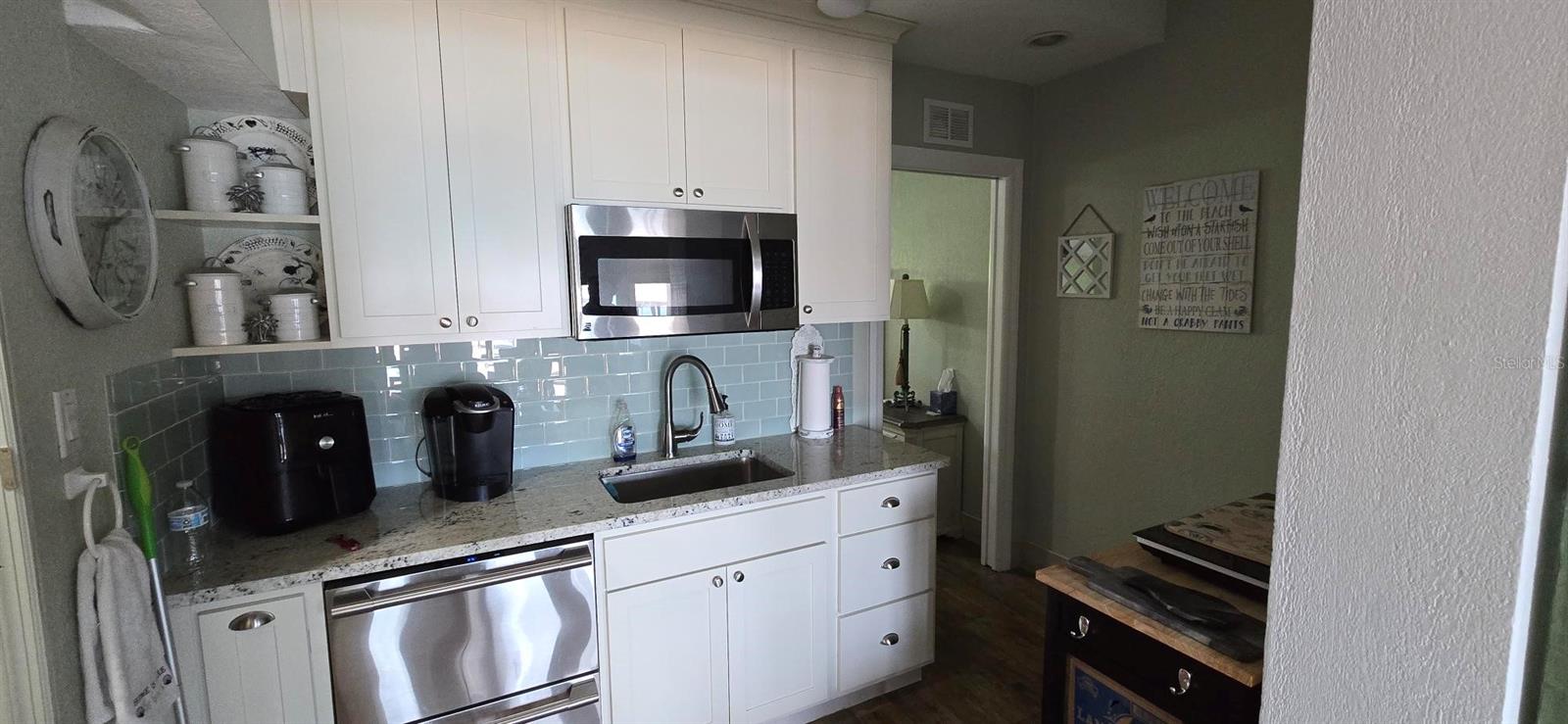 Kitchen. (Triplex unit 2, 1st floor, 476 sq ft, 1/1). Pic taken before Hurricane Helene.