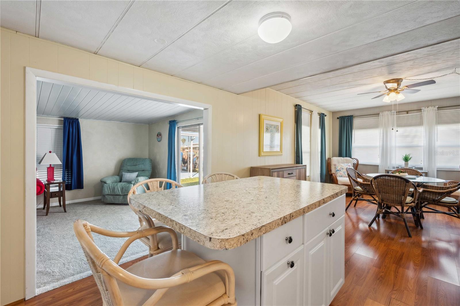 Kitchen opens to living and dining room.