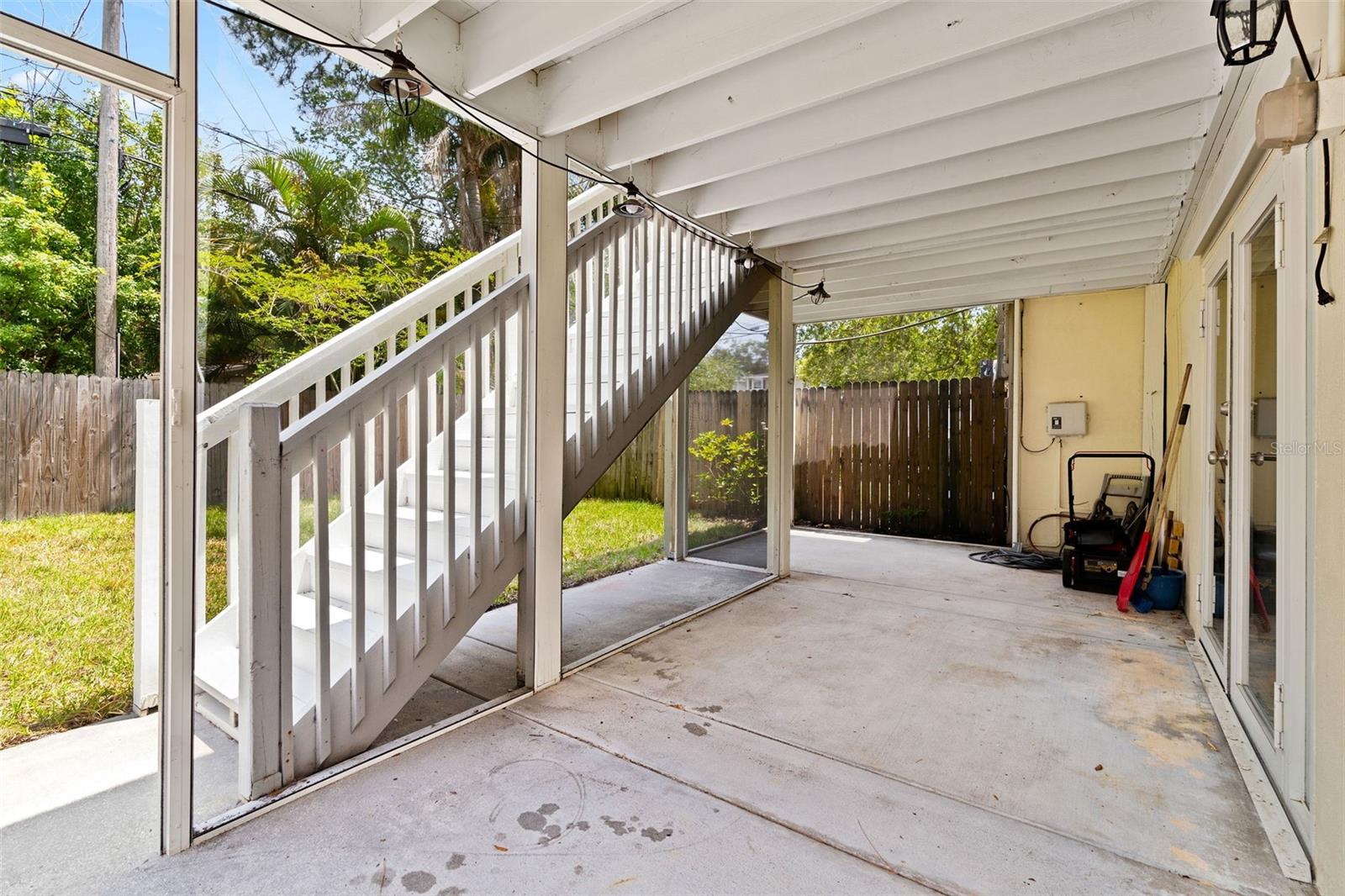 Walk out to the backyard from the ground floor, into a screened in patio.