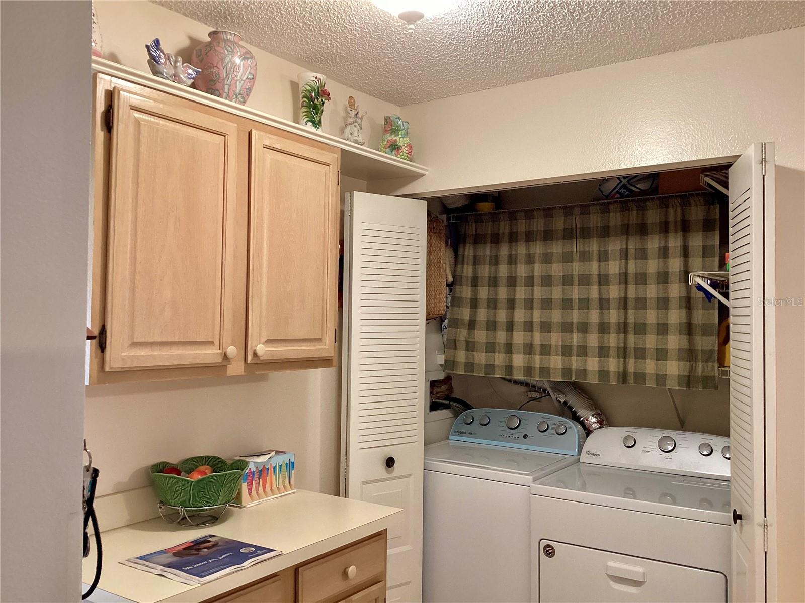 Laundry closet with NEW Whirlpool washer & dryer.