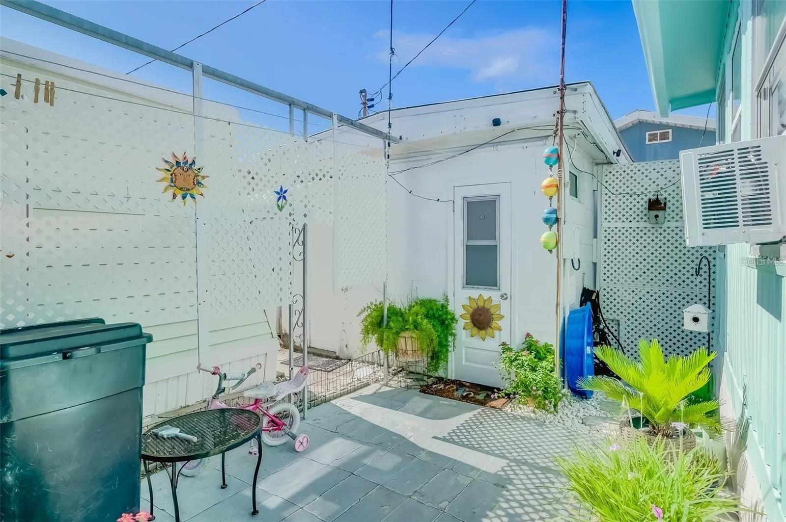 Outdoor Half Bath with Washer and Dryer