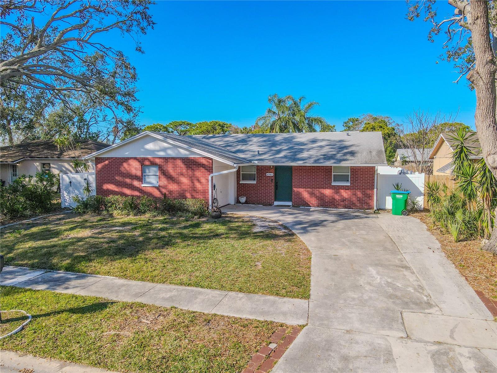 Move-in ready 3 Bedroom, 2 bath Ranch style pool home with oversized 1 car garage.