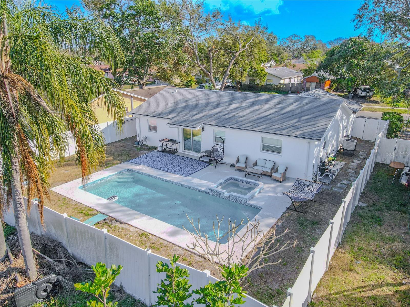 Large salt water pool and spa with private fenced in backyard.