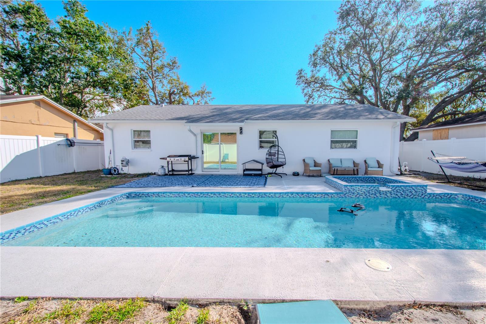 Back yard with salt water pool and spa.