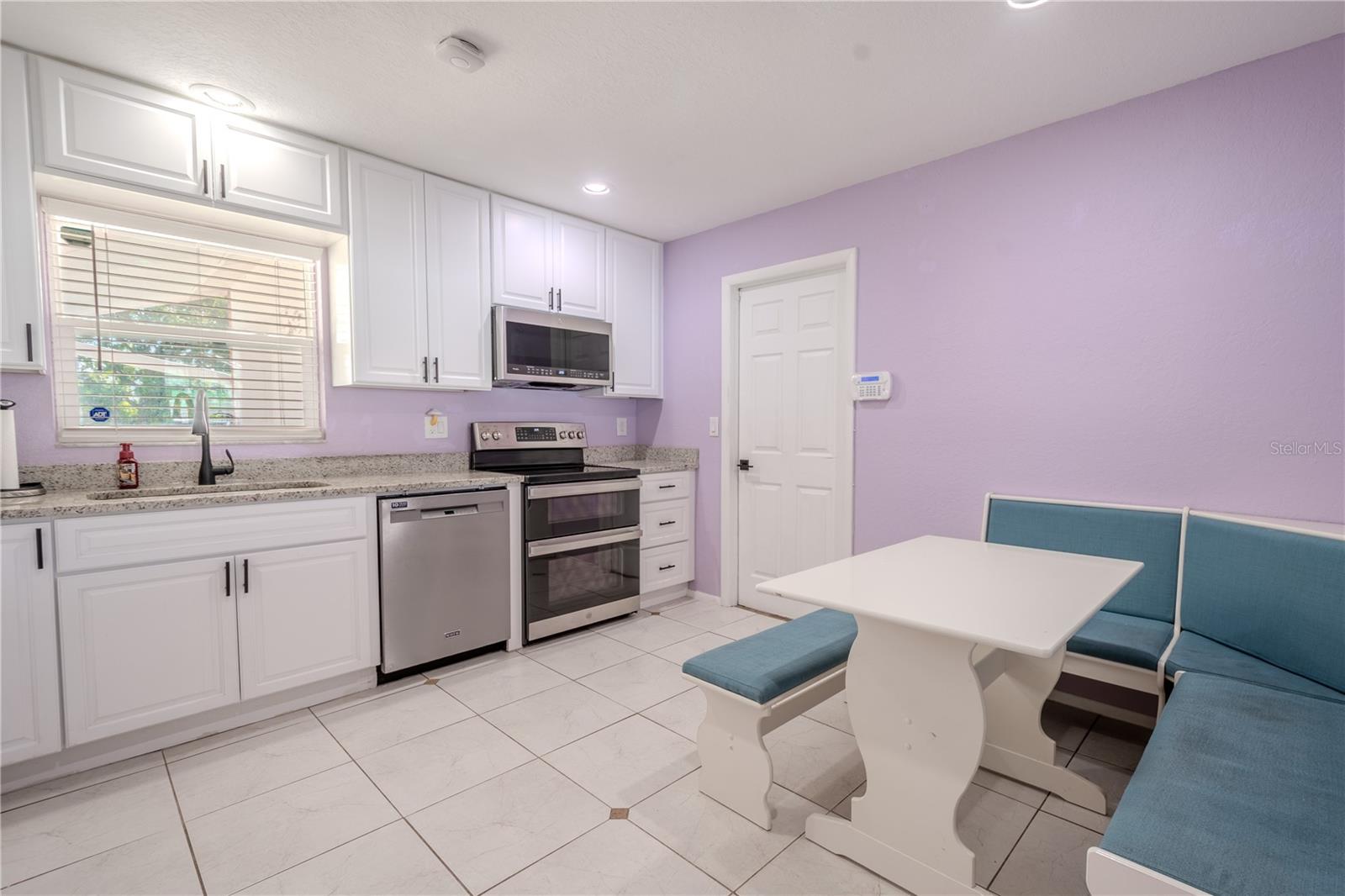 The kitchen door opens to the garage.