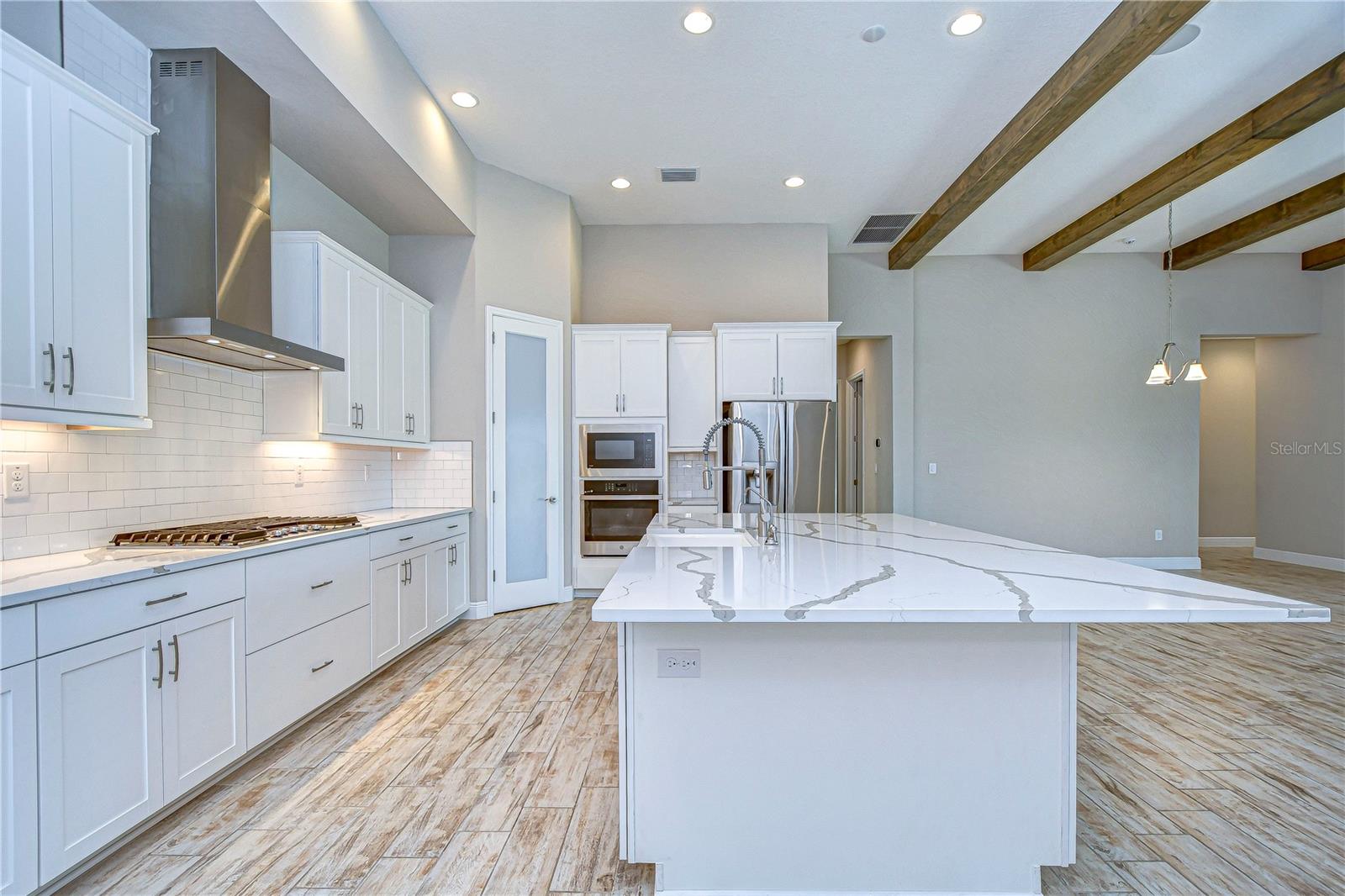 Kitchen with boasts modern luxury.