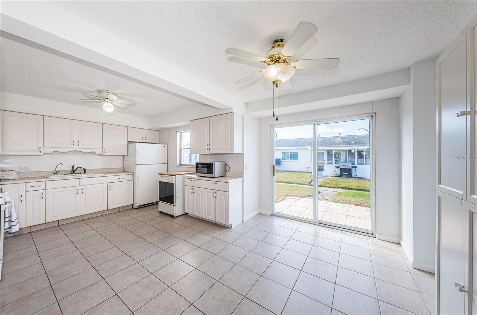 View from dinette into kitchen and living/dining area