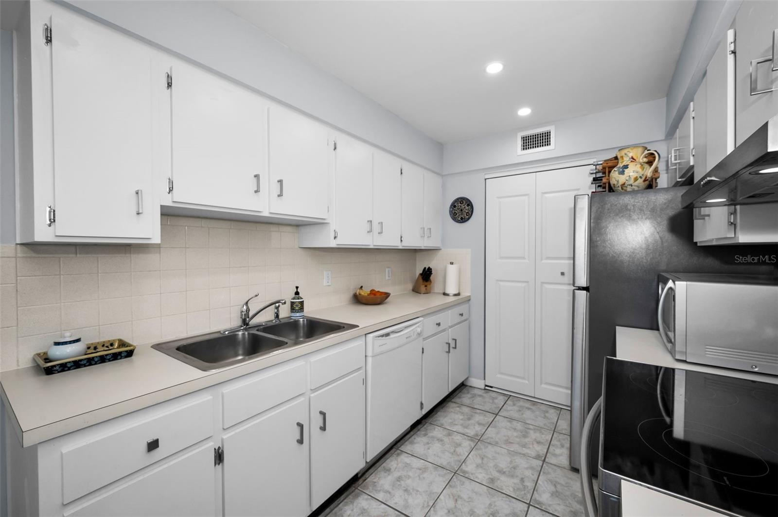 Cabinet packed kitchen with a pantry