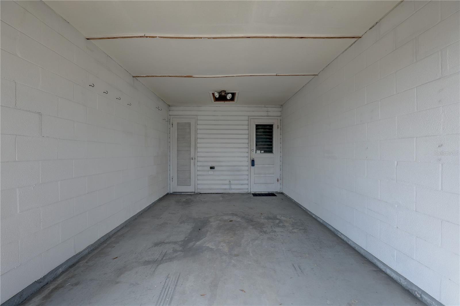 Private carport with dryer hookup and utility closet